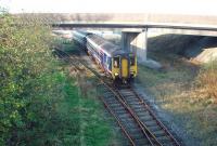 Having met the incoming Isle of Man ferry the boat train, formed by 156452, heads back to Morecambe and Lancaster. It would return to connect with the outgoing 1415 sailing although from the December 2008 timetable only one train a day would meet the ship. The nuclear power station line goes off to the left under the bridge that carries the access road to that site and to the ferry terminal. <br><br>[Mark Bartlett 25/11/2008]