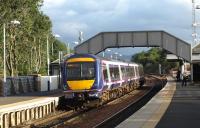 Dalmeny station looking south in October 2008 with a Fife circle service boarding at the up platform.<br><br>[Brian Forbes /10/2008]