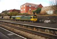 Freightliner 66507 takes loaded coal wagons from Portbury docks through Parson Street station, Bristol, towards Temple Meads on 26 November, probable final destination Fiddlers Ferry power station.<br><br>[Peter Todd 26/11/2008]