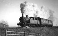 50731 looks to be working hard with its single coach from Bury, near Sunnywood Halt, but the Holcombe Brook branch was a 1:50 climb for most of its length and 1:40 on the final mile where goods trains were limited to seven wagons if unassisted. <br><br>[W A Camwell Collection (Courtesy Mark Bartlett) 03/02/1952]