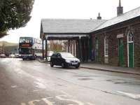 The old station at Windermere has been converted into a supermarket with the original 1847 building, including this covered entrance, happily surviving the metamorphosis.  The line has been cut back only a very short distance and the bus is just leaving the second station on a service for Lancaster.<br><br>[Mark Bartlett 27/11/2008]