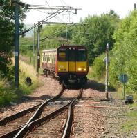 314 201 comes out of the reversing siding at Neilston on 28 July and is about to draw into platform 1 where it will form the next service to Glasgow Central.<br><br>[David Panton 28/07/2008]