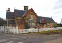 The 1852 Onibury Station building (now a private residence) stands beside the level crossing on the A49 road between Craven Arms and Ludlow on the S&HJ line. The door beneath the porch still states <I>Booking Office</I> although tickets have not been sold here for quite a few years now, having closed to passengers in 1958!<br>
<br><br>[John McIntyre 18/11/2008]