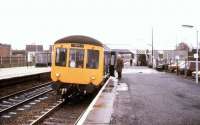 Boarding a Birmingham - Leamington Spa service at Hatton in December 1980.<br><br>[Ian Dinmore /12/1980]