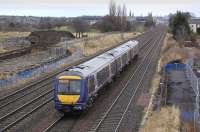 An eastbound service passes Saughton on 5 December heading for its next stop at Haymarket. The train is passing preparations for the abutments of the bridge which will carry the Edinburgh Tramway over the E&G and Fife lines. One classic view will disappear, but leapfrogging trams will compensate!<br><br>[Bill Roberton 05/12/2008]