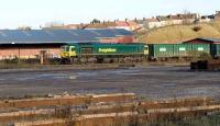 Freightliner 66596 heading towards Bristol Temple Meads with a freight on 3 December passing Bristol East Goods.<br><br>[Peter Todd 03/12/2008]