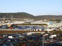 The old carriage cleaning sidings at Inverness have been replaced with this container handling facility. Stobart Rail delivers containers for Tesco here every day except Sunday. 66411 in Stobart Rail livery has brought in the train on 6 December.<br><br>[John Gray 06/12/2008]