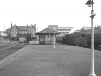 Black 5 44850 stands at the platform at Possil in October 1964, the month the station closed. View east towards the station building on Balmore Road.<br><br>[Colin Miller /10/1964]