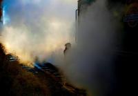 Scene at Winchcombe on the Gloucestershire Warwickshire Railway on 7 December as the fireman changes the tender lamps on 7903 <I>Foremarke Hall</I>.<br><br>[Peter Todd 07/12/2008]