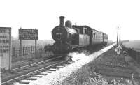 Although this print of 50651 and its push pull set has no details it is believed to have been taken on the last day of passenger services, just outside the Holcombe Brook terminus at the start of the 1:40 gradient down to Tottington, hence the wagon brakes notice. Unfortunately, this small collection of branch pictures does not contain any of Tottington or Greenmount stations in operation. Does anyone have any that they could supply to our editor to <I>complete the set?</I>.<br><br>[W A Camwell Collection (Courtesy Mark Bartlett) 04/05/1952]