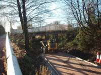 Ever since final closure in 1967 the bridge over the Longridge branch trackbed south of Grimsargh has been a traffic bottleneck without serving any real purpose. Now however, a footpath and cycleway from the village is being extended and will pass under the road at this point. There are seperate footbridges on both sides of the narrow road bridge. View towards Ribbleton and Preston at Map Ref SD584342<br><br>[Mark Bartlett 10/12/2008]