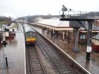 A remarkable contrast with Cam Camwell's picture of Ramsbottom, [See image 21508] taken one week before closure, is this view 36 years later showing how effective the East Lancashire Railway's efforts have been. The DMU is for Rawtenstall and is waiting to connect with a <I>Santa Special</I> from Bury.<br><br>[Mark Bartlett 13/12/2008]