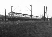 A 3 car Metropolitan-Cammell DMU has just set off from Cardross with a service from Helensburgh Central to Glasgow on Sunday 7 November 1971. DMUs were substituting for the normal electric trains on this occasion due to major weekend engineering works near Hyndland, resulting in services running to Queen Street High Level.<br><br>[John McIntyre 07/11/1971]