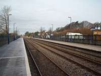 Basic but tidy facilities at Giggleswick, for the five trains a day each way service, with a waiting shelter on the Skipton and Leeds platform but nothing on the Carnforth side. The Leeds platform is substantially constructed but the other is supported on wood trestles. View towards Clapham. <br><br>[Mark Bartlett 15/12/2008]