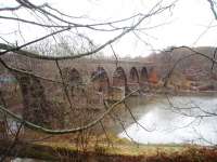 It looks like there was an intention to double the line later when the Holcombe Brook branch was built in 1882. This is Tottington viaduct with its double width piers and single track arches spanning the river and mill lodge. It carried its last passengers in 1952, and final goods train in 1960, and is now part of the Kirklees Trail.<br><br>[Mark Bartlett 13/12/2008]