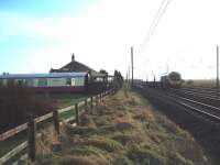 Famous for many years as The Sidings Hotel, with accommodation in MkI coaches, this building alongside the ECML is now an Italian Restaurant. The station itself, Shipton and  Beningbrough, closed in 1958, was a short distance to the north. 185108 heads south in this view towards York. <br><br>[Mark Bartlett 17/12/2008]