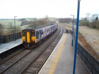 The other <I>Clapham Junction</I>. The westbound platform at Clapham (North Yorks) has a sharp curve towards Bentham betraying its original junction status. The line to Sedbergh, and on to the WCML at Low Gill, went straight ahead at this point until final closure in 1966. 150228 leaves on a service from Leeds to Lancaster and Morecambe.<br><br>[Mark Bartlett 15/12/2008]