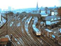 A Metro-Cammell DMU photographed leaving the east end bays at Newcastle Central in 1972 on a North Tyne loop service. The former NER parcels depot stands in Westgate Road on the right. [See image 9463] <br><br>[John Alexander //1972]