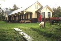 The former station at Redcastle on the Black Isle looking west towards Muir of Ord. Seen from the trackbed in October 1999, having been refurbished as a Post Office and shop. [See image 21840]<br>
<br><br>[Colin Miller 04/10/1999]