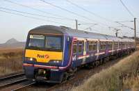 322 481 leaving Drem with a North Berwick-Edinburgh service on 20 December. In the left backround stands the ancient conical basalt volcanic plug that is North Berwick Law.<br><br>[Bill Roberton 20/12/2008]