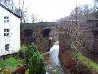 If the East Lancashire Railway's original preservation plans had come to fruition this viaduct, over the River Ogden, would be carrying steam trains from Stubbins Junction to Grane Road. However, in 1972, the preservation society moved from Helmshore to Bury to concentrate on reopening the line to Rawtenstall and the tracks on the former line to Accrington, closed in 1966, were lifted.<br><br>[Mark Bartlett 13/12/2008]