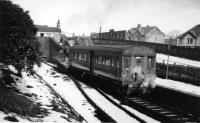 <I>Arctic conditions at Holcombe Brook</I> is Cam Camwell's description on the back of this picture, even though there is some thawing on the ground. The steam heating is certainly warming the single autocoach as 50731 stands in front of the station building and retaining wall waiting to return to Bury. <br><br>[W A Camwell Collection (Courtesy Mark Bartlett) 03/02/1952]