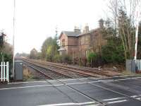 Thirteen of the fifteen stations between York and Scarborough closed on 22nd September 1930 leaving only Malton and Seamer still open. This is Strensall where, 78 years after closure, the station building is still used as a home. View towards York from the level crossing.<br><br>[Mark Bartlett 15/12/2008]