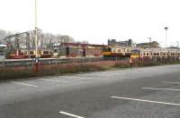 Looking north towards Airdrie station from the car park on Boxing Day 2008. On the left the 1208 Drumgelloch - Helensburgh service has just arrived at the platform, while in the bay in the centre an Aidrie - Balloch train is next out. The train on the far right is standing in the stabling siding. The gentleman striding purposefully along the platform is hurrying to advise me that taking photographs of Airdrie station is illegal. After responding that I had been unaware of this, thanking him for the information, apologising for any difficulties I may have caused and wishing him a happy and prosperous 2009, I left.<br>
<br><br>[John Furnevel 26/12/2008]