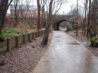 The station at Tottington, almost 57 years after the last passenger train called, but with the platform remains still in place. This view is towards Greenmount and Tottington viaduct is just a short distance beyond the overbridge along the trackbed cyclepath. The small goods yard, closed in 1963, lay to the left of the platform and is still an open area.<br><br>[Mark Bartlett 13/12/2008]