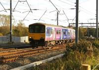 150138 snakes its way across the WCML at Euxton Junction with a service from Manchester to Blackpool North on 1 November 2008. The unit is seen crossing from the Down Fast to the Up Slow and is about to cross to the Down Slow before accelerating to its next stop at Leyland.<br>
<br><br>[John McIntyre 01/11/2008]