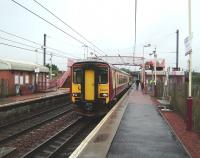 A wet Whifflet station welcomes 156 508 on a terminating service from Glasgow Central on 20 August 2008. The train will run forward and reverse onto the little used Whifflet South Junction - Sunnyside Junction freight line, off to the right behind the platform, where it will lie-over pending the next scheduled service back to Glasgow Central. <br><br>[David Panton 20/08/2008]