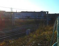 A pair of 156s creeping through the shadows onto Muirhouse South Junction off the little used link from Larkfield Junction on their way to Crossmyloof to start their next turn. In the foreground is Muirhouse Central Junction. Work at Glasgow Central meant buses replaced trains between Crossmyloof, Pollokshields and Glasgow. The low sun and long shadows suggest an earlier time but the photo was taken at 11am on 29 December 2008.<br>
<br><br>[Fraser Cochrane 29/12/2008]