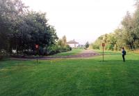 Looking towards the former Balloch Pier station and Loch Lomond in September 1993. Only the north end of the platform remains with the rest of the site having been landscaped by this stage. [Compare with image 7721 & 16428.] <br><br>[David Panton /09/1993]