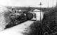 Immediately after the steam push pull trains had taken over from the electric trains on the branch L&YR 2-4-2T 50829 pulls in to Brandlesholme Road Halt, serving a suburb of Bury, on the 4.16pm from Bury Bolton Street to Holcombe Brook. Electric operation officially finished three days later so this would have been one of the first steam operated services. Brandlesholme Road passed over the bridge and is still the main road from Bury out to Holcombe Brook. <br><br>[W A Camwell Collection (Courtesy Mark Bartlett) 22/03/1951]