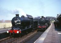 Class J37 no 64602 stands at Anstruther with a railtour in the early 60s as B1 61330 runs into the station with a southbound train. Anstruther closed to passengers in September 1965. The B1 was withdrawn in 1966 and the J37 a year later.<br><br>[Robin Barbour Collection (Courtesy Bruce McCartney) //]