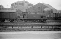 Guild Street yard, Aberdeen on 29 July 1958. McIntosh 0-6-0T no 56240, built at St Rollox Works in 1898, takes a break from shunting duties.  The locomotive was eventually withdrawn from 61B Ferryhill shed in July 1961 and cut up at Inverurie works a short time later.<br><br>[Robin Barbour Collection (Courtesy Bruce McCartney) 29/07/1958]