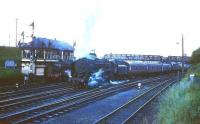 Britannia Pacific 70017 <I>Arrow</I>, pulls away from Carstairs in the 1960s passing Kingmoor shedmate 45018 standing alongside No 2 box.<br><br>[Robin Barbour Collection (Courtesy Bruce McCartney) //]