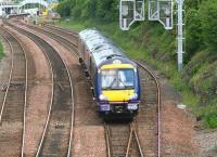 ScotRail 170459 runs downhill from Dalmeny station on 26 June 2008 with a Fife Circle train returning to Waverley. The yard visible in the background is used to hold equipment and materials for use in connection with maintenance of the Forth Bridge [see image 54772].<br><br>[John Furnevel 26/06/2008]