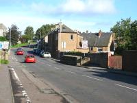 Looking northwards along William Street, Dunfermline, in September 2006. In the centre right of the picture stand the remains of the centre pillar of a two-span bridge which carried the Stirling to Dunfermline Railway across the Elgin Railway and the present day street [See image 22280]. After the construction of the Stirling to Dunfermline Railway a junction was made with the Elgin Railway just to the west of here c 1850.<br><br>[Mark Poustie 23/09/2006]