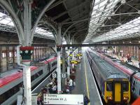 A busy Preston station looking South on 7th January 2009, with 156472 on a local service sandwiched between two Pendolinos, one Northbound and one Southbound<br><br>[Graham Morgan 07/01/2009]