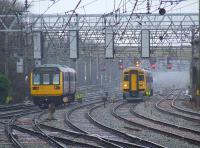 Looking South at Preston on 7th January 2009. A Northern Pacer about to pass a Class 158 on a service to Blackpool North<br><br>[Graham Morgan 07/01/2009]