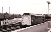 Signal check at Doncaster in February 1981 as a class 31 is held at the platform<br><br>[Peter Todd 07/02/1981]