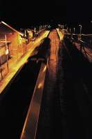 Northbound coal empties pass through New Cumnock at night.<br><br>[Ewan Crawford 03/01/2008]