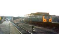 A DMU stands under the remains of the overall roof at the old Bedford St Johns station on the former Oxford - Cambridge line in 1976. The remains were finally swept away in 1984 when a <I>modern replacement</I> was built slightly to the north on the spur to Bedford Midland. The modern day St Johns is served by the hourly service running between Bedford Midland and Bletchley. [See image 34689] <br>
<br><br>[Ian Dinmore //1976]