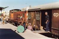 Algarve branch goods being unloaded at Portimao, Portugal on 22 September 1989. Loco is 1211. <br><br>[Bill Roberton 22/09/1989]