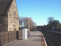 The view east at Dalton towards Ulverston, showing the former station building, now a private house, and the new waiting shelters beyond. To the right of the bridge over the railway a second, now blocked up bridge, can be seen. This previously afforded access to the goods yard, now built over. Dalton enjoys a reasonable level of service by Northern Rail trains between Barrow and Lancaster.<br><br>[Mark Bartlett 17/01/2009]