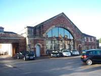 The original Furness Railway passenger terminus at Ulverston only lasted 20 years until 1874 when it was replaced by the current through station. It survived for many years as a railway goods depot, alongside its replacement, but has now been converted into a Mercedes showroom that retains many original railway features including the glazed frontage.<br><br>[Mark Bartlett 17/01/2009]