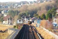 The footbridge at the eastern end of Grange promenade provides an excellent vantage point. Looking back towards the station 153360 is seen leaving for Lancaster on a service that started at Sellafield.<br><br>[Mark Bartlett 17/01/2009]