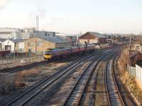 Although the Transpennine Services do not stop at Kirkham, 185140 was routed through the platform road on this Manchester Airport to Blackpool North train. This view, from the overbridge outside the station entrance, is towards Kirkham North Junction with the fast lines on the right of the picture.<br><br>[Mark Bartlett 06/01/2009]