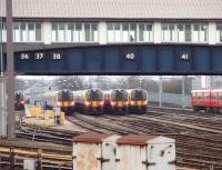 Pre-rush hour line up of SWT 444 and 450 stock in the depot sidings at Clapham Junction. These sidings sit between the Richmond and Wimbledon line platforms. Serving both Waterloo and Victoria termini, the number of trains moving through Clapham Junction at any given time has to be seen to be believed.<br><br>[Mark Bartlett 16/01/2009]